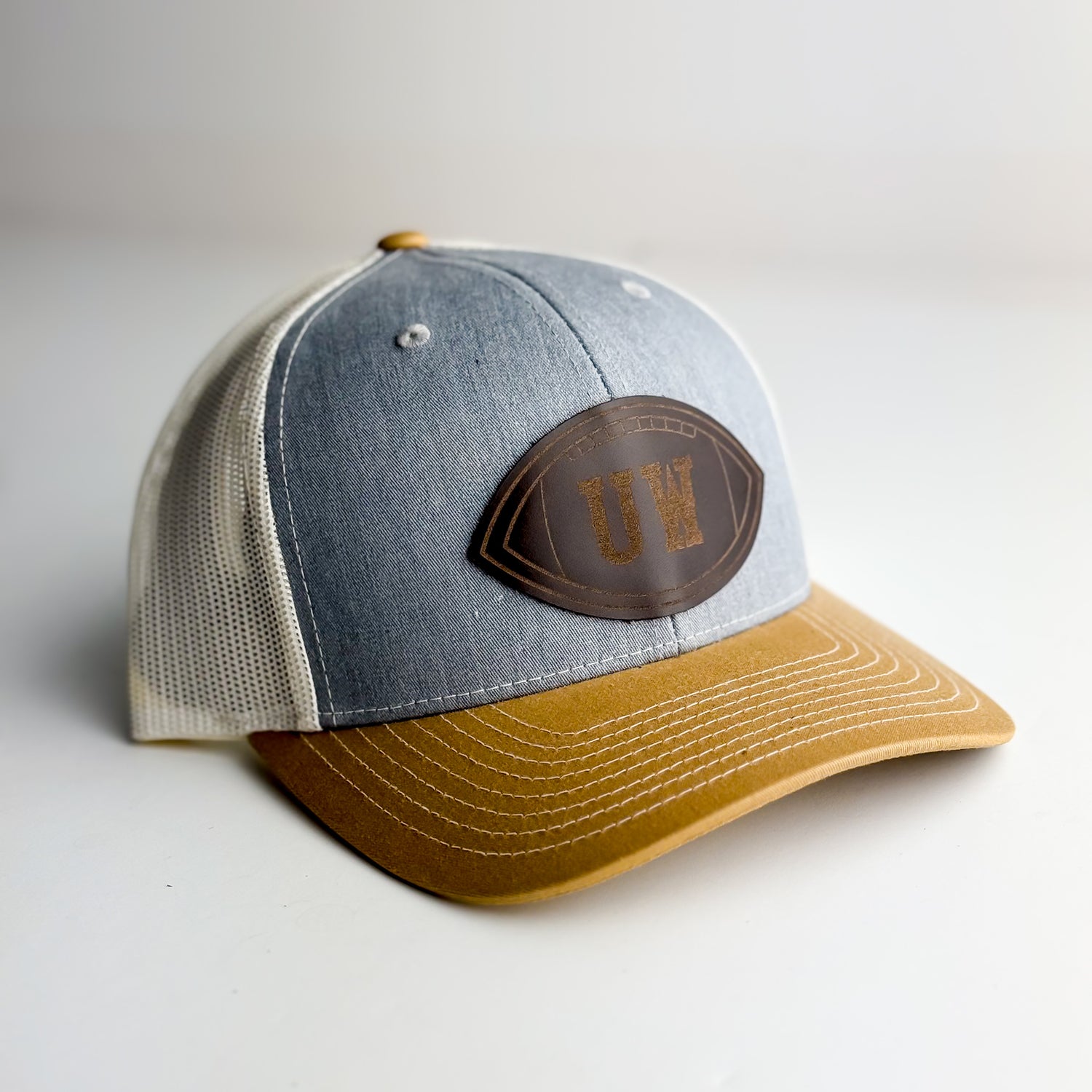 Steamboat Collection | UW Football Trucker Hat | Yellow + Rocky