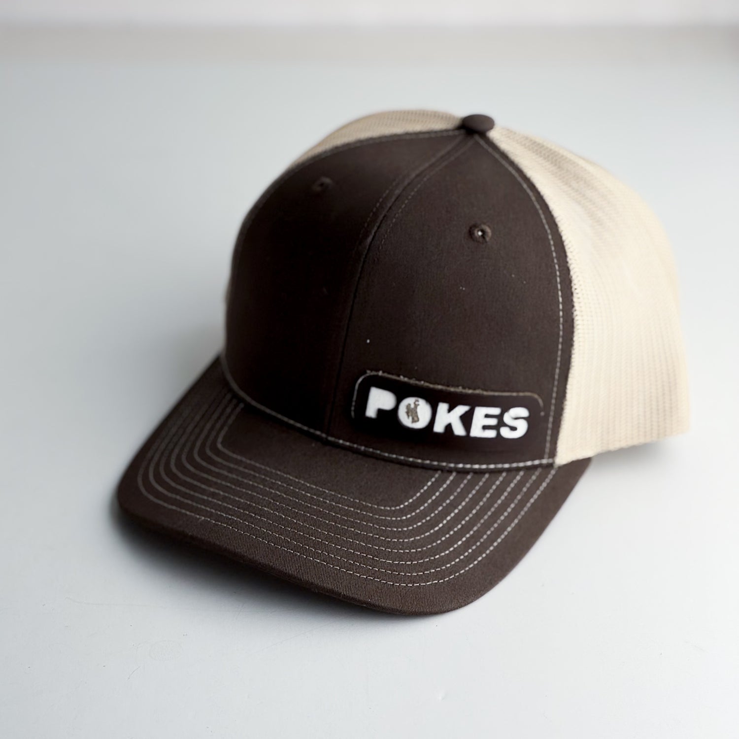 Steamboat Collection | Pokes Trucker Hat | Brown + White