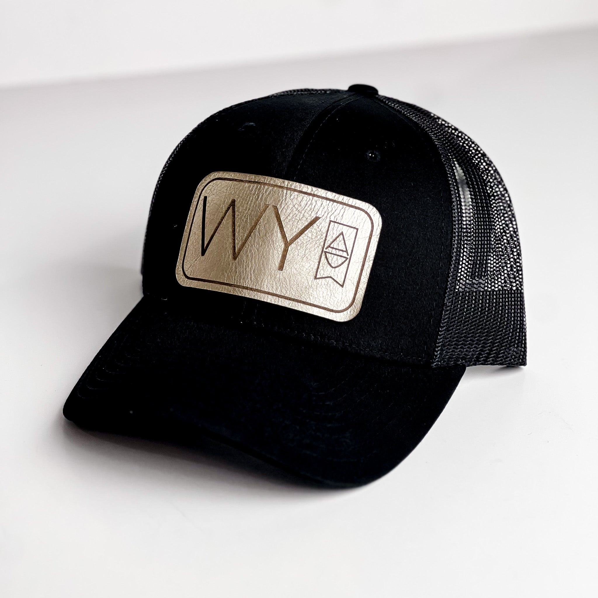 WY Trucker Hat | Black + Platinum Patch